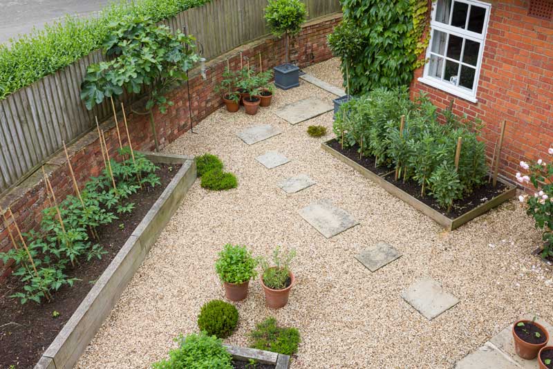 back garden using gravel as an alternative to grass lawn