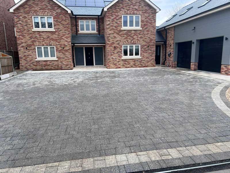 large driveway in charcoal grey with contrasting cream border
