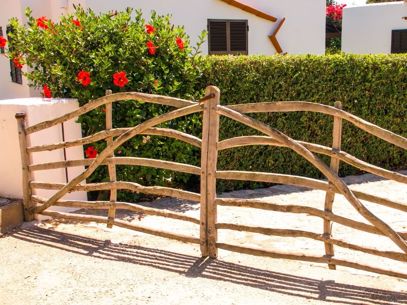 A carefully positioned hedge creates a privacy screen between house and driveway