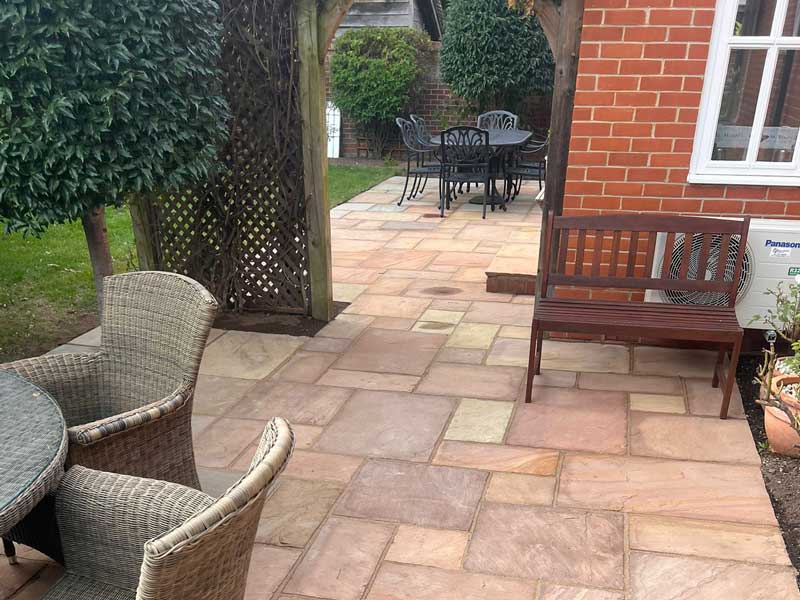 beautiful traditional sandstone patio with areas for outdoor dining and for morning coffee